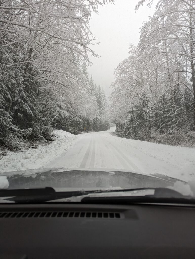 Driving over mountain pass in snow to change a front brake caliper